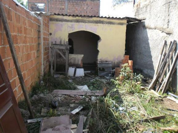 Terreno murado com casa em construção,muito barato