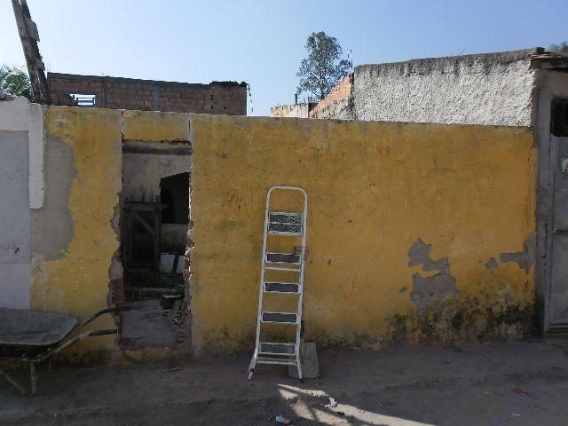 Terreno murado com casa em construção,muito barato